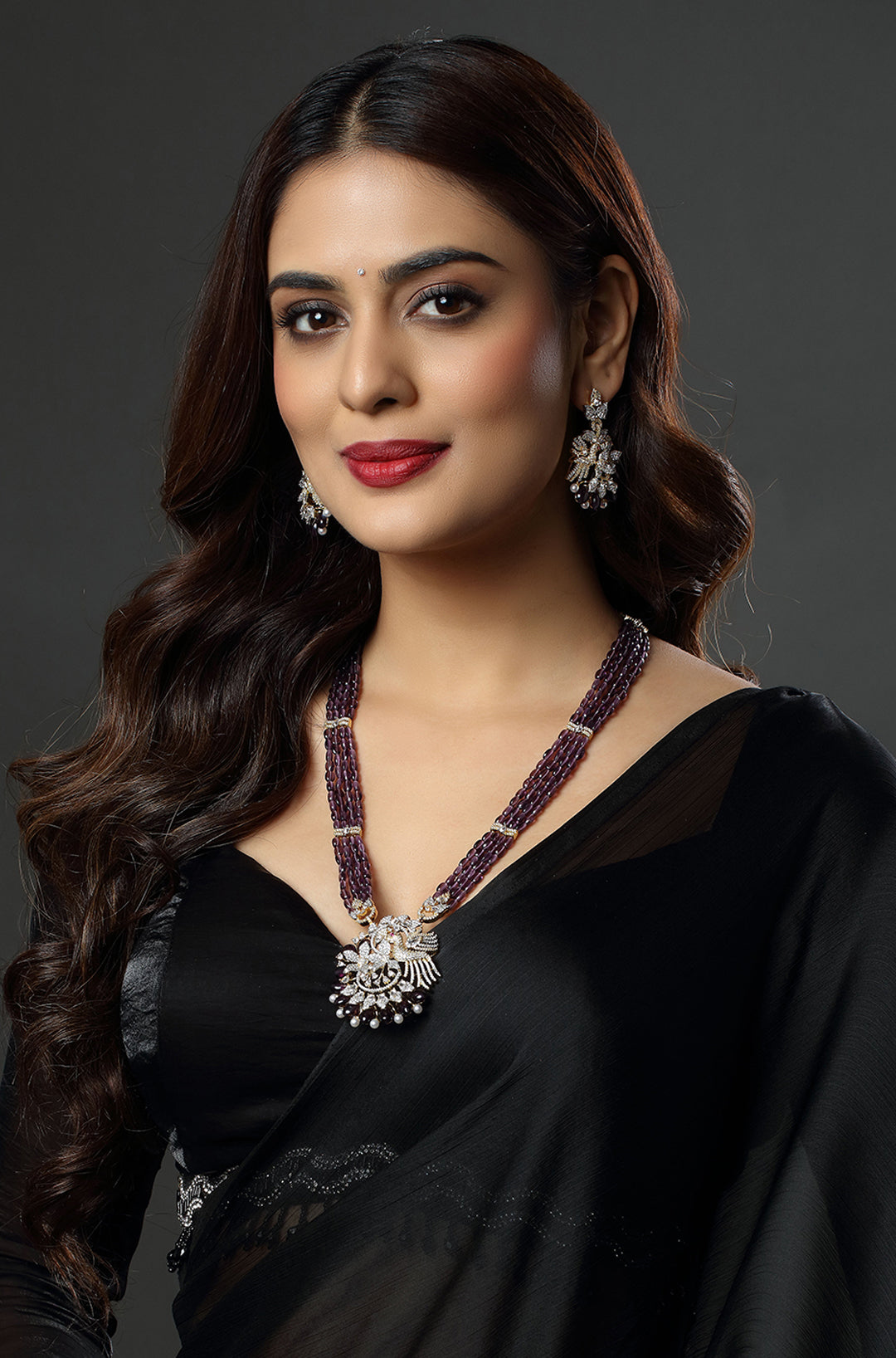 Majestic Purple Beaded Necklace with an Intricate Bird Pendant