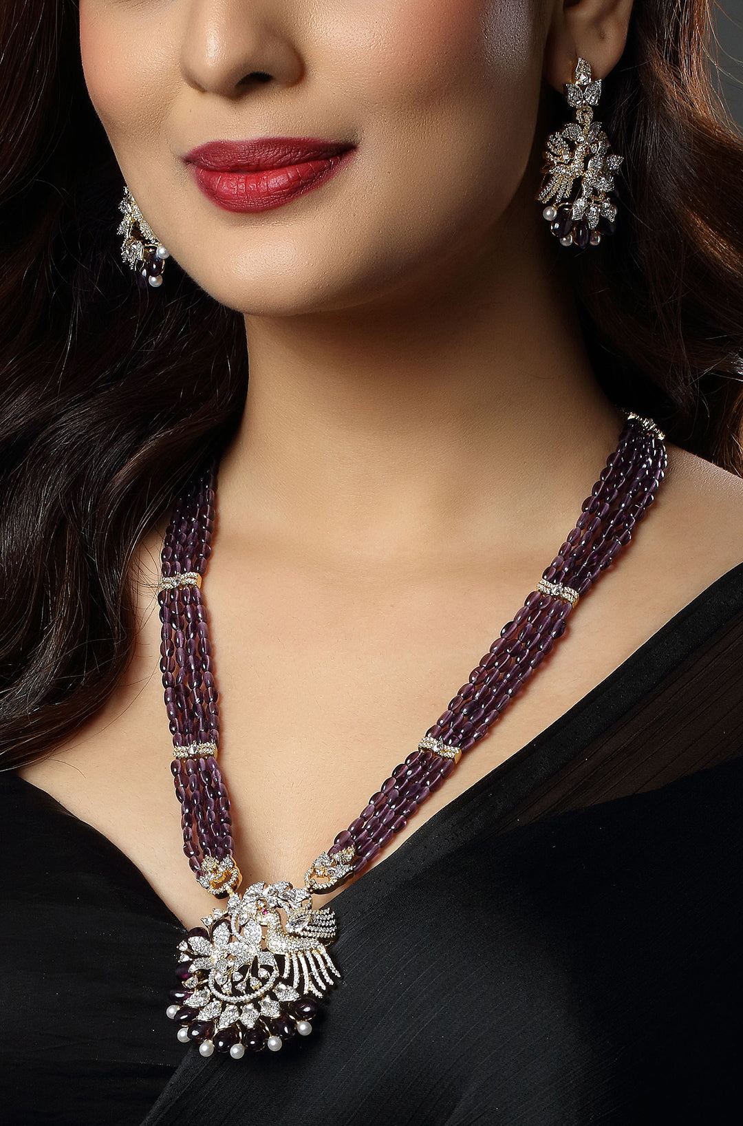Majestic Purple Beaded Necklace with an Intricate Bird Pendant