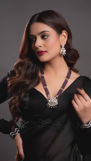 Majestic Purple Beaded Necklace with an Intricate Bird Pendant